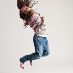 Young girl jumping.