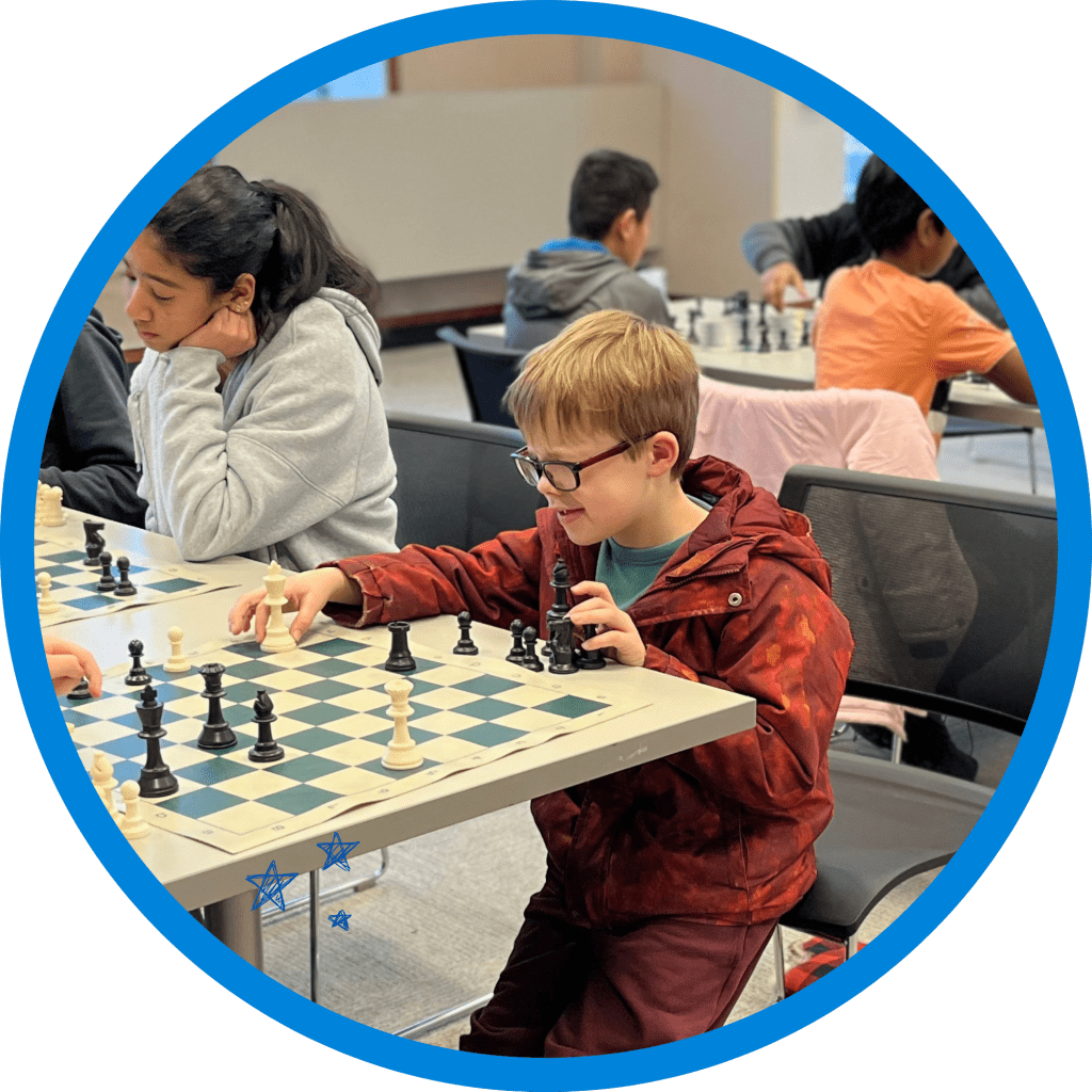 Young boy playing chess.