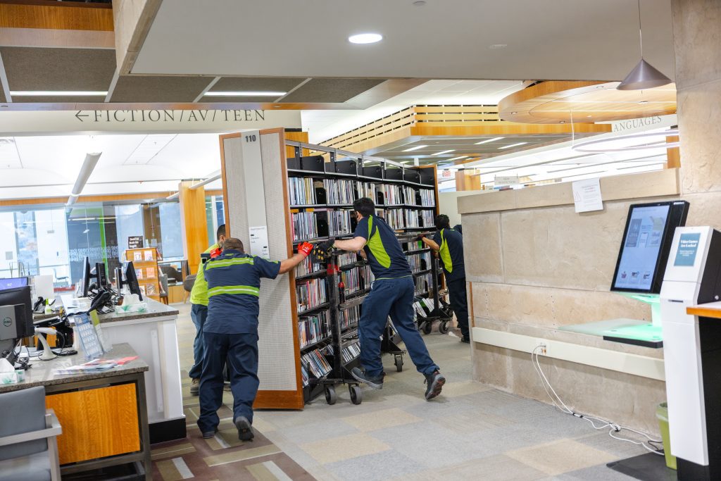 Hallett movers moving an entire stack across the second floor.