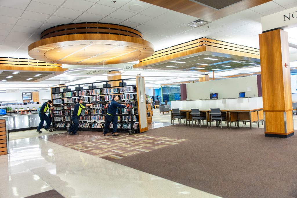 Hallett movers moving an entire stack across the second floor.