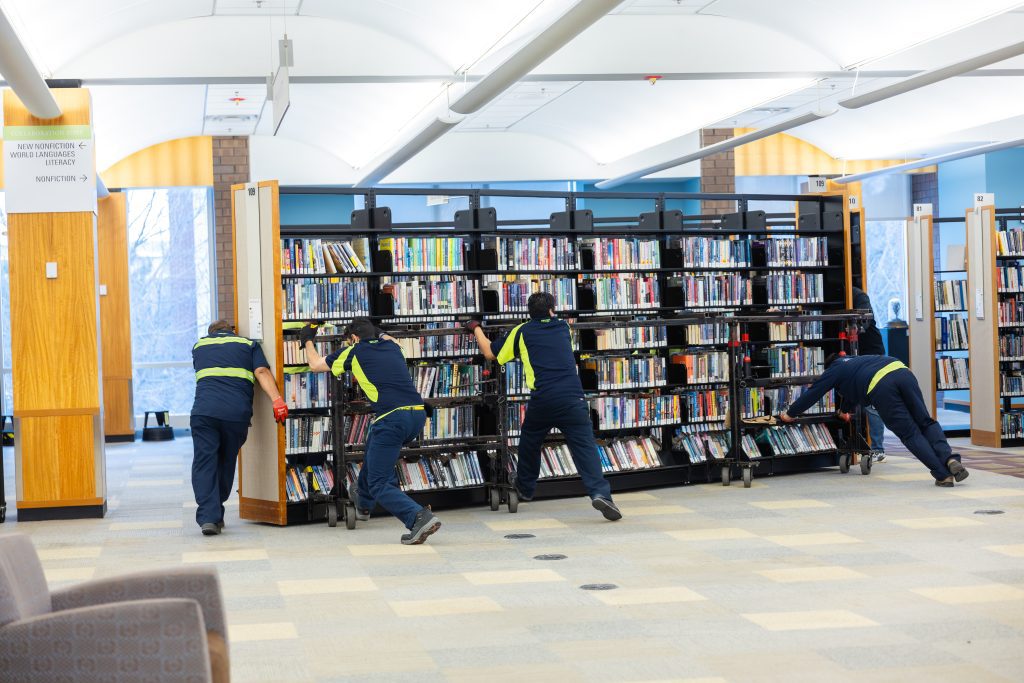 Hallett movers sliding a stack into its new location.